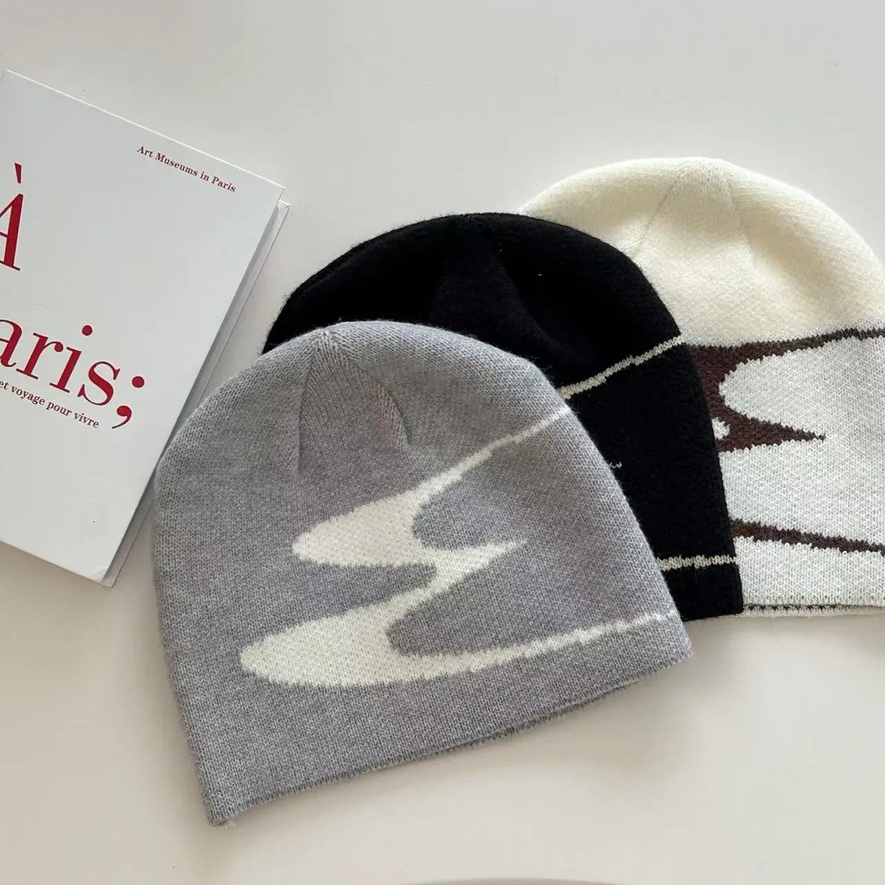 Medium acrylic fibre knitted beanie hat in black grey or white for autumn winter spring seasons