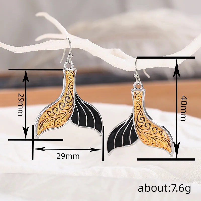 Women's retro whale fishtail alloy earrings in white gold colour, approximately 3cm length