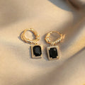 A pair of black zircon geometric copper French court earrings with a quadrilateral shape.