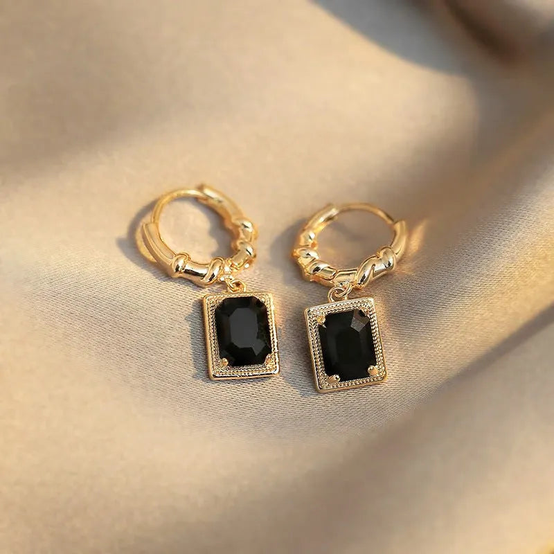 A pair of black zircon geometric copper French court earrings with a quadrilateral shape.