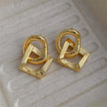 Geometric circle pendant earrings with 3.4cm drop in gold or silver electroplated finish