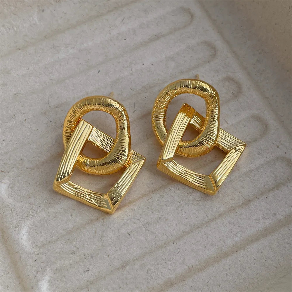 Geometric circle pendant earrings with 3.4cm drop in gold or silver electroplated finish