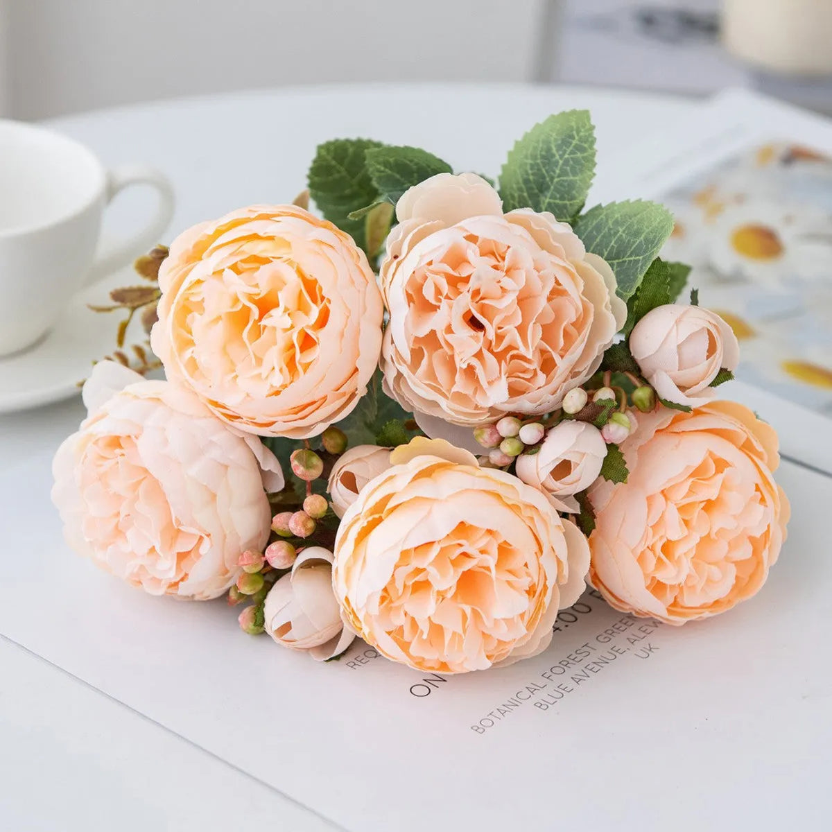 Silk artificial peony bouquet in champagne colour for table decoration