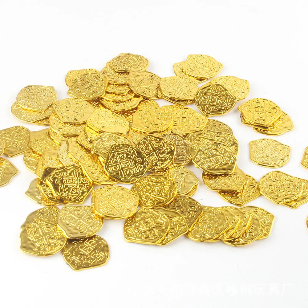 A pile of plastic Roman coins with a metallic gold finish, part of a 100-piece set for treasure-themed parties.