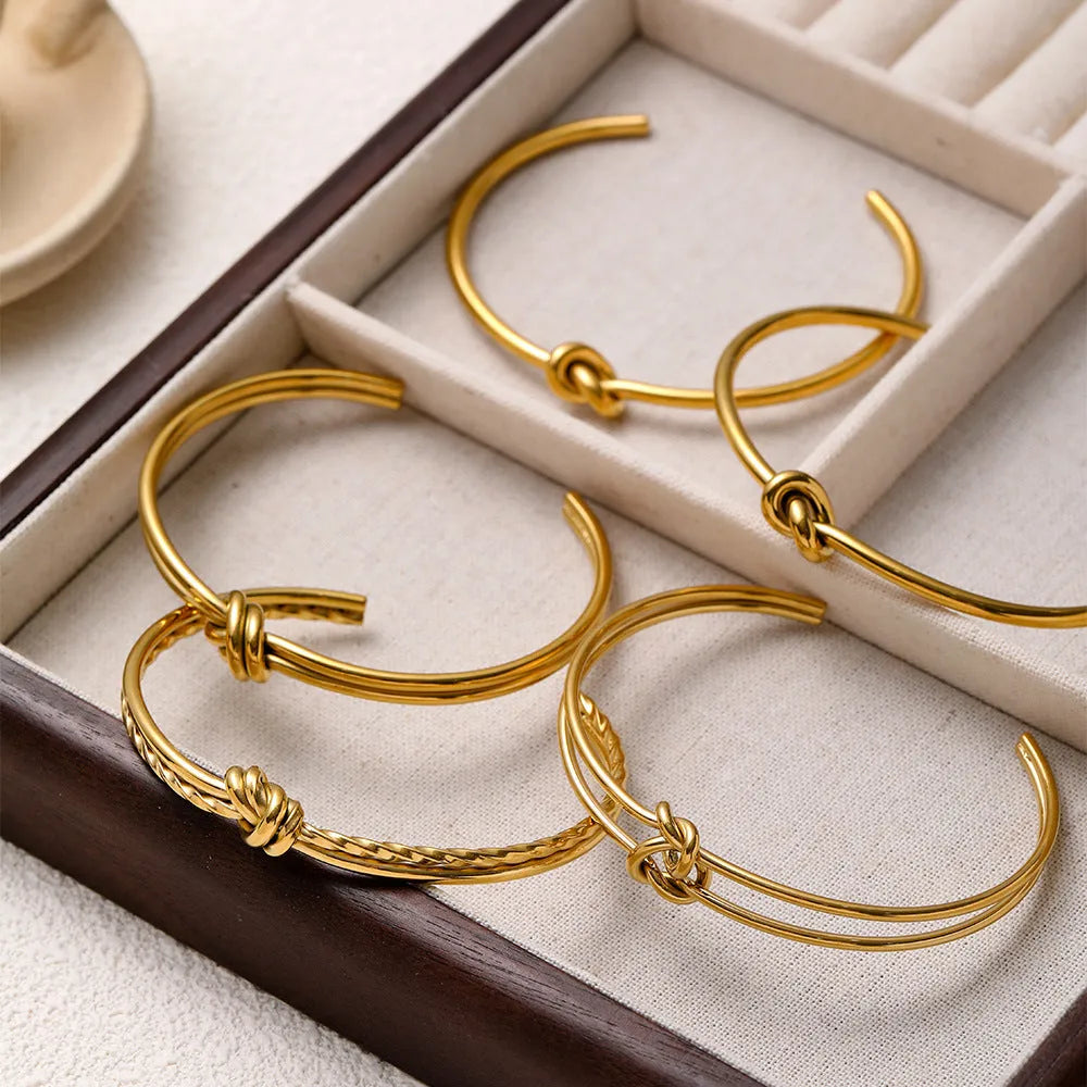 Adjustable knotted C-shaped double-layer bracelet in stainless steel with gold plating