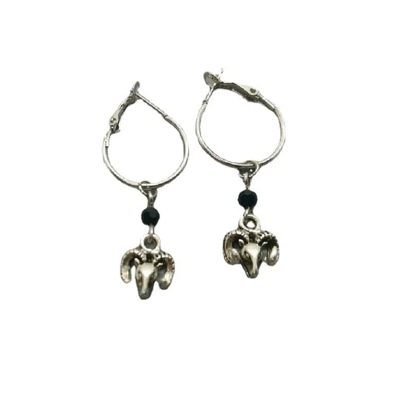 A pair of silver-coloured alloy round ring earrings with Tibetan antelope design inspiration.