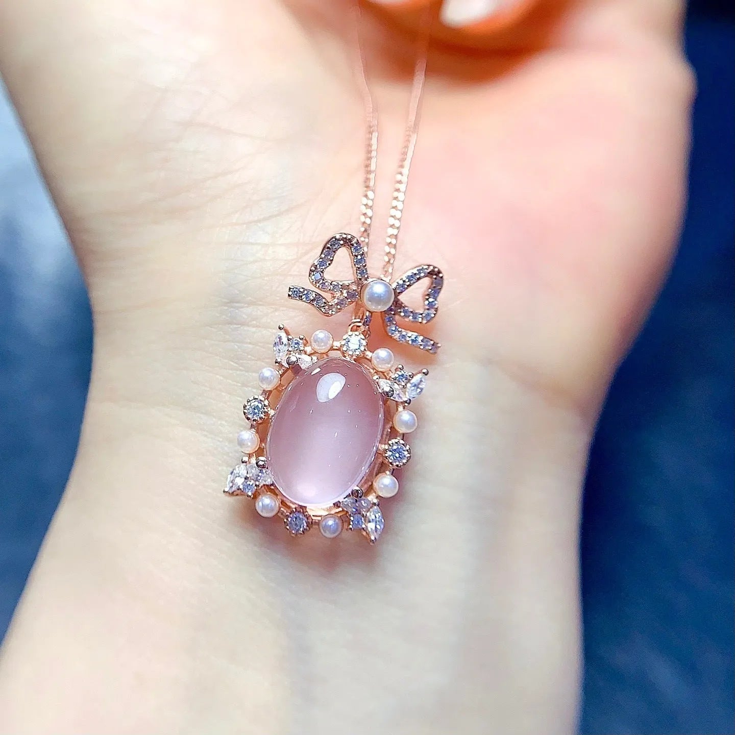 Geometric rose quartz pendant necklace with rose gold plated silver mounting on alloy chain