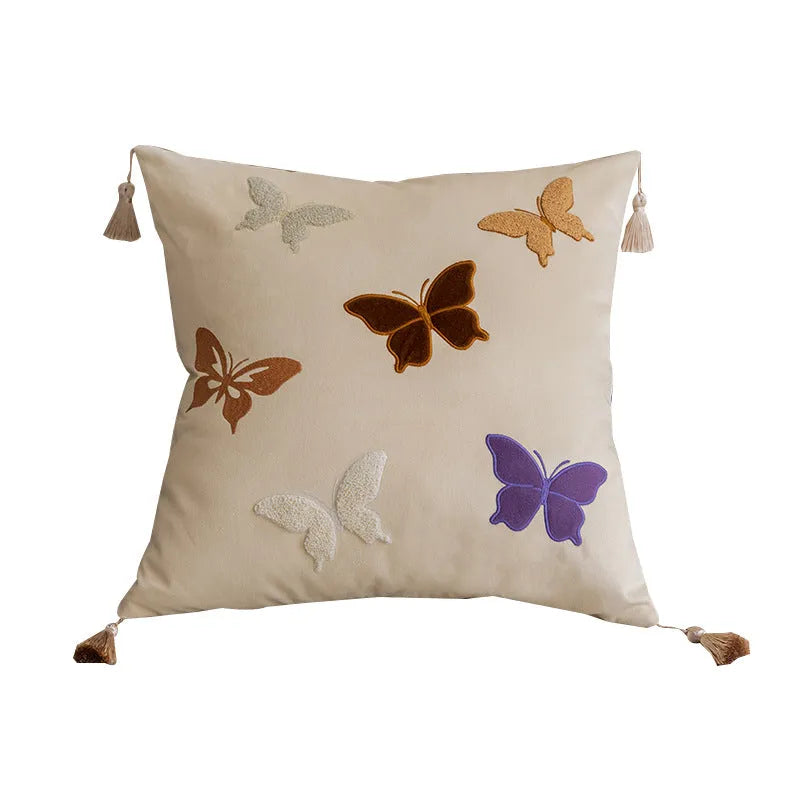 Square beige cushion with black butterfly embroidery in a Chinese style, 45cm by 45cm.