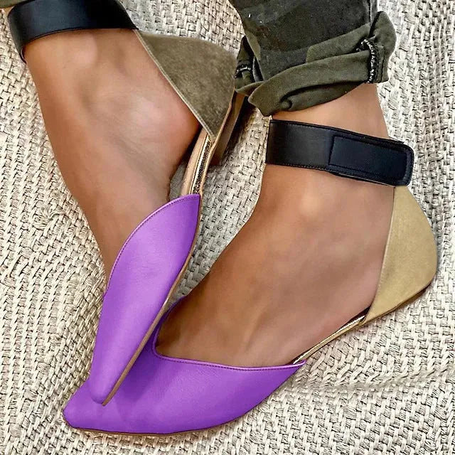 Women's flat-heel sandals with velcro straps and a hollowed upper design, shown in a beige colour.