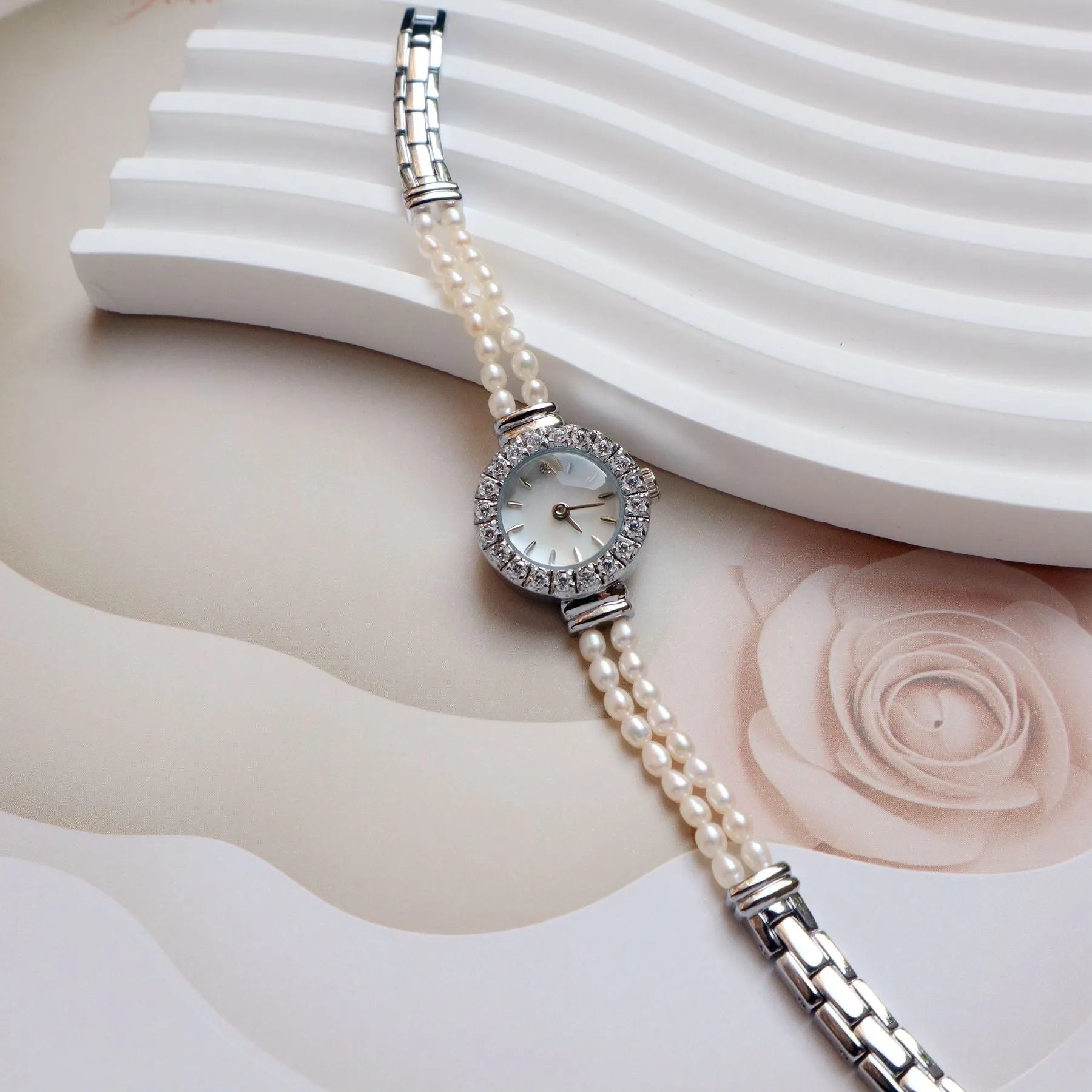 Women's light gold bracelet watch with freshwater pearls and 18mm round dial