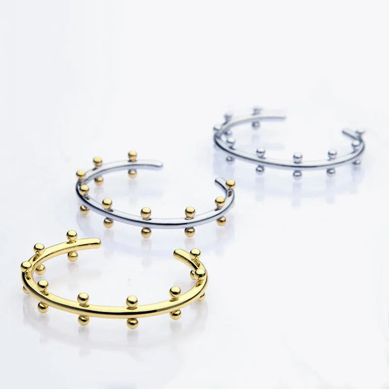 Stainless steel C-shaped bracelet with rivet bean bead texture in gold, steel, or steel gold colour