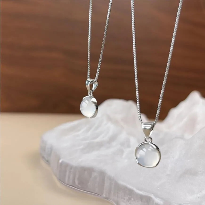 Korean-style women's oval pendant necklace with artificial crystal star on an adjustable box chain.