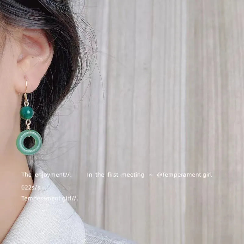 Green jade design peace buckle earrings with 14K gold plating and geometric ring details for Hanfu style