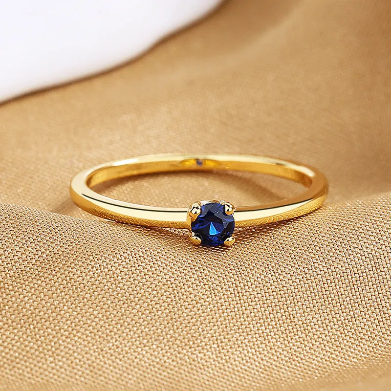 Women's copper circle ring with single diamond in blue, green, red or white colour