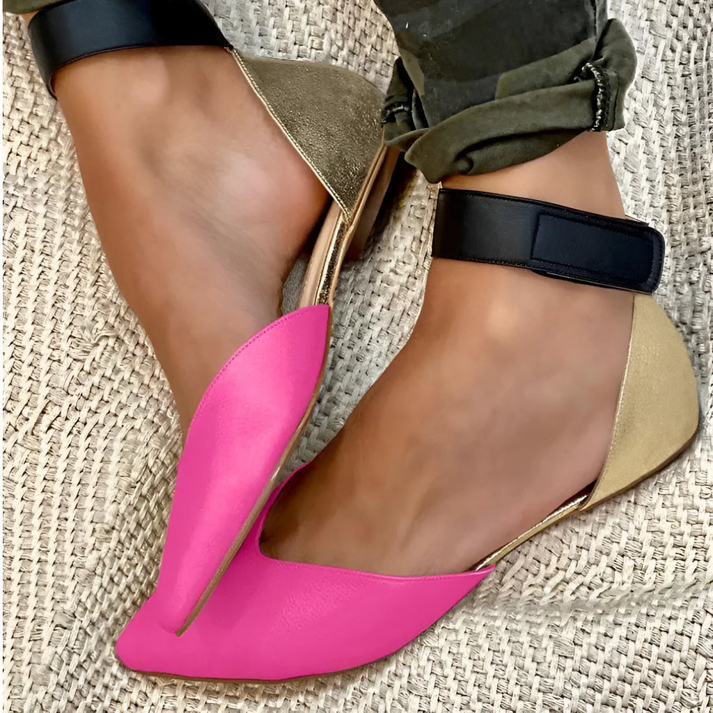 Women's flat-heel sandals with velcro straps and a hollowed upper design, shown in a beige colour.