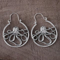 A pair of vintage antique silver octopus earrings with detailed animal modelling and a retro style.