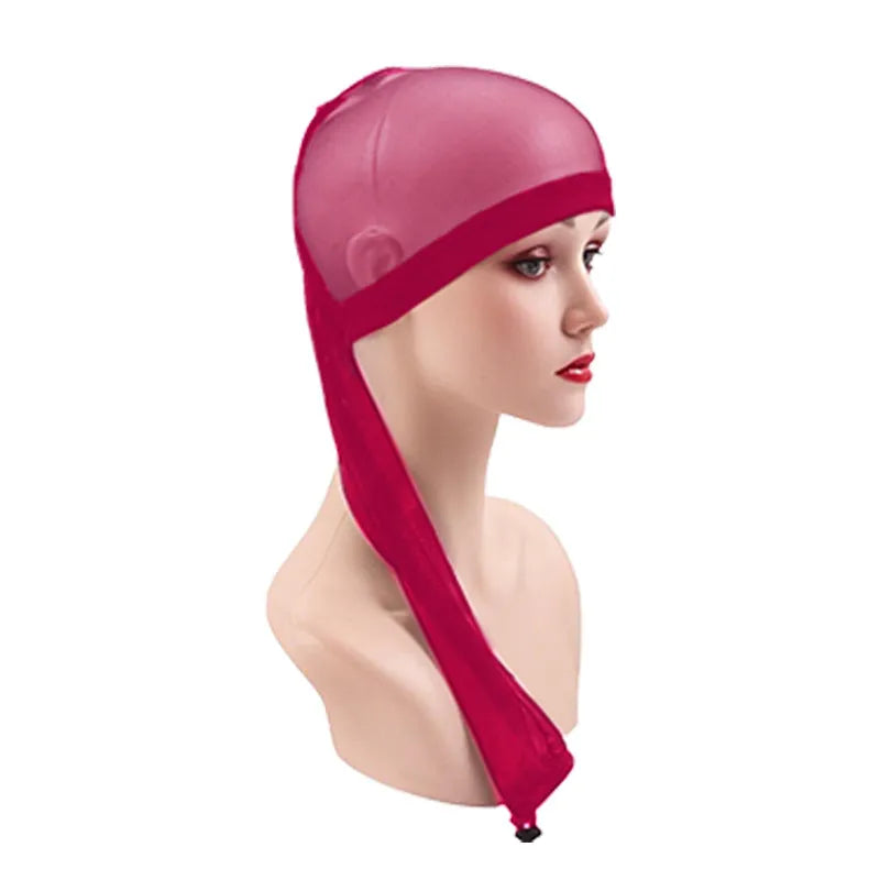 Mesh wig cap with elastic oversleeve design shown in various colour options including leopard print
