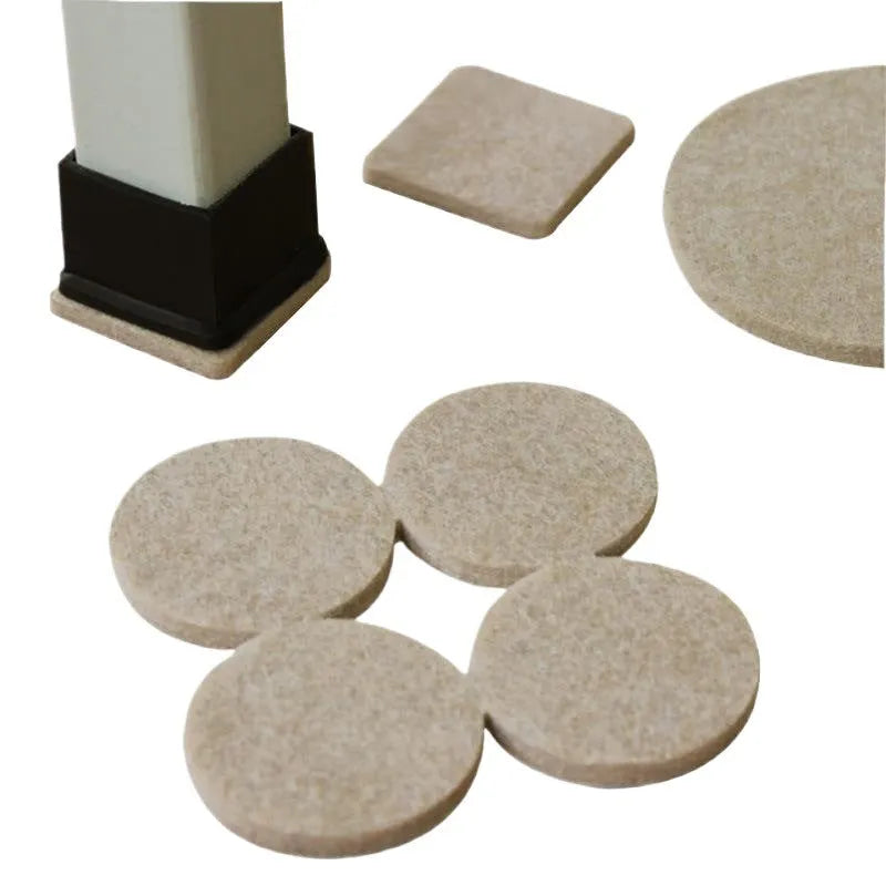 Beige plastic furniture leg stopper pads in five different sizes on a wooden floor