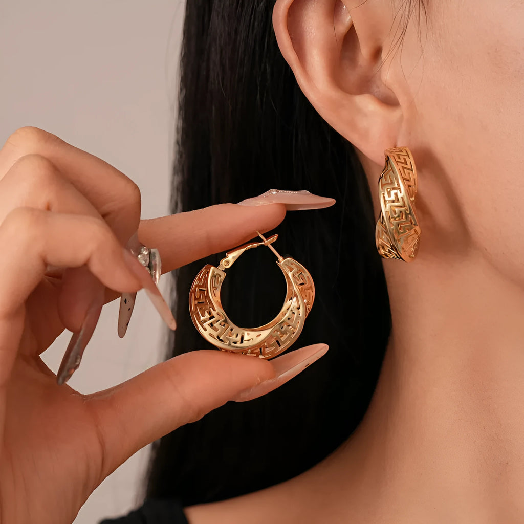 Geometric hollow stud earrings with twisted round design in gold electroplated finish