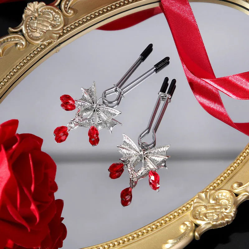 Silver bat nipple clamp with adjustable ruby clip for clitoral stimulation
