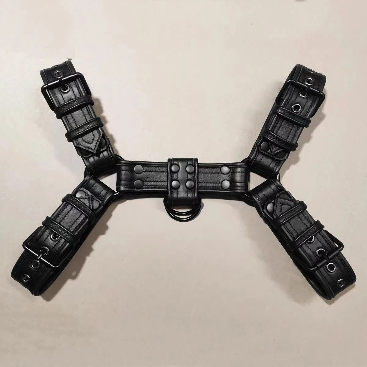 Black leather adjustable chest muscle bondage strap with metal buckle fastening