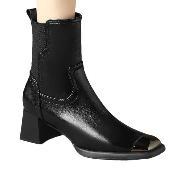 Women's brown cowhide Martin boots with high heel and side zipper, featuring decorative metal elements