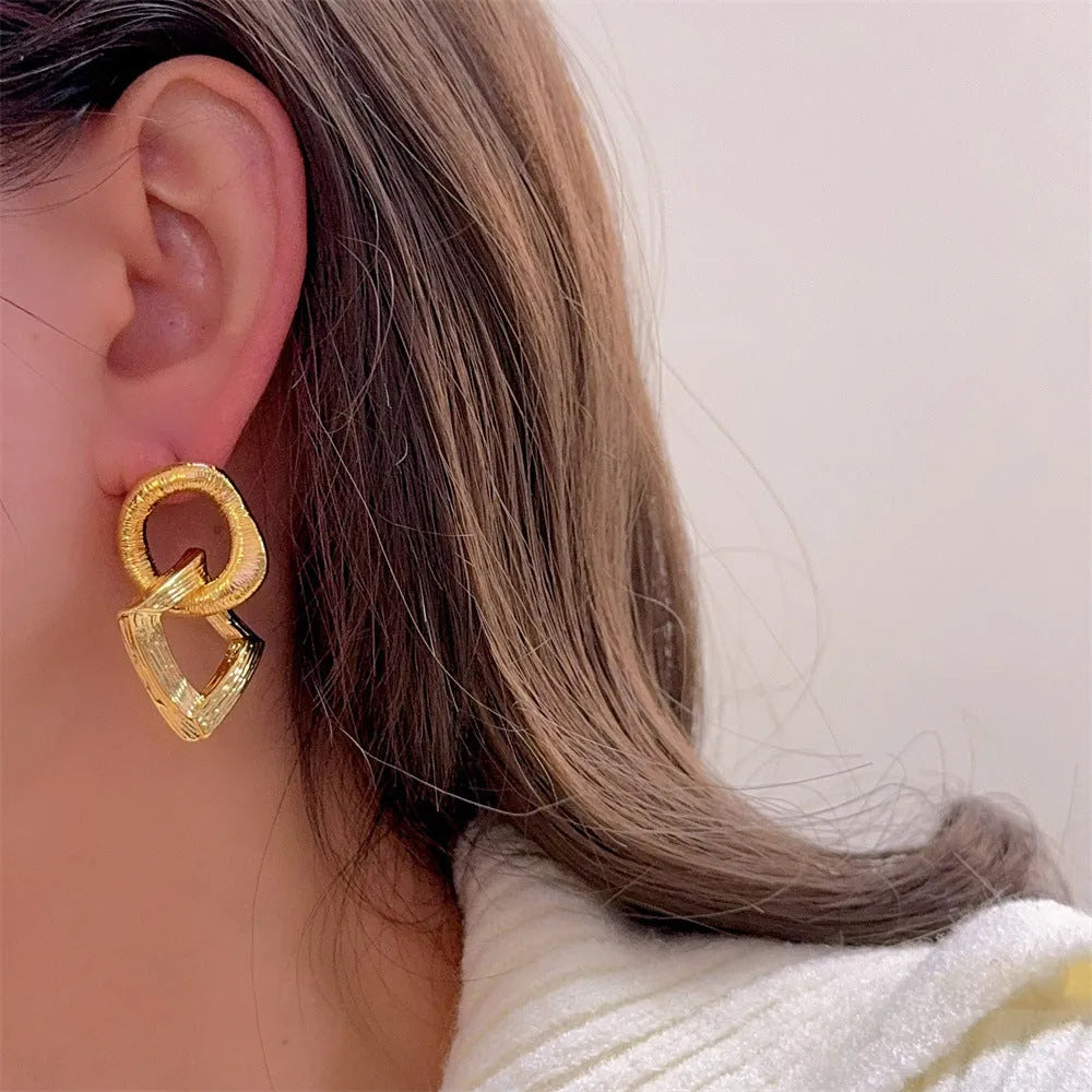 Geometric circle pendant earrings with 3.4cm drop in gold or silver electroplated finish