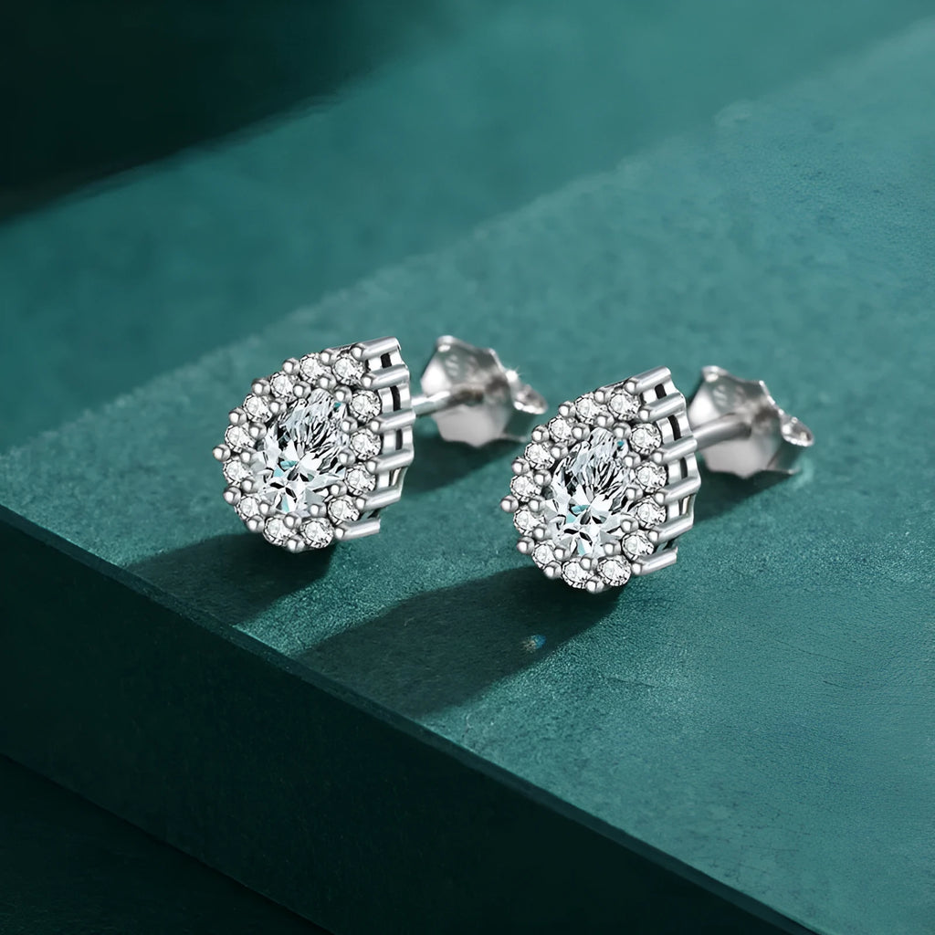 Women's silver water drop ear studs with 925 sterling silver construction and diamond treatment