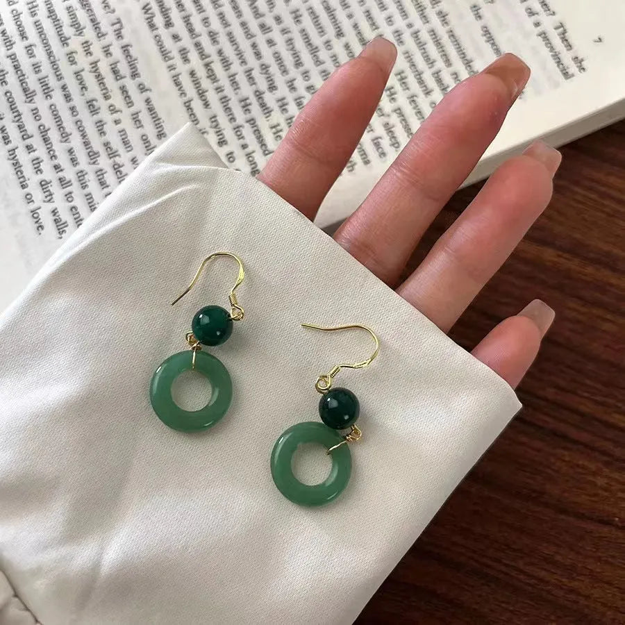 Green jade design peace buckle earrings with 14K gold plating and geometric ring details for Hanfu style