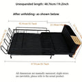 Foldable carbon steel kitchen drain rack for cutlery, knives, forks, spoons, and cups on a worktop.