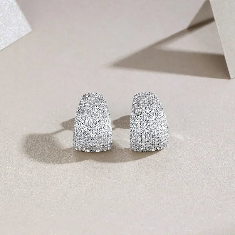 Geometric women's ear studs in sterling silver with white moissanite stones.