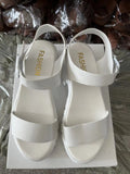 Beige women's peep toe platform sandals with ankle-strap buckle on a neutral background.