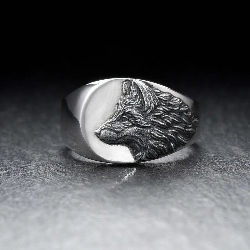 Men's silver alloy ring with geometric wolf design showing side profile