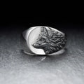 Men's silver alloy ring with geometric wolf design showing side profile