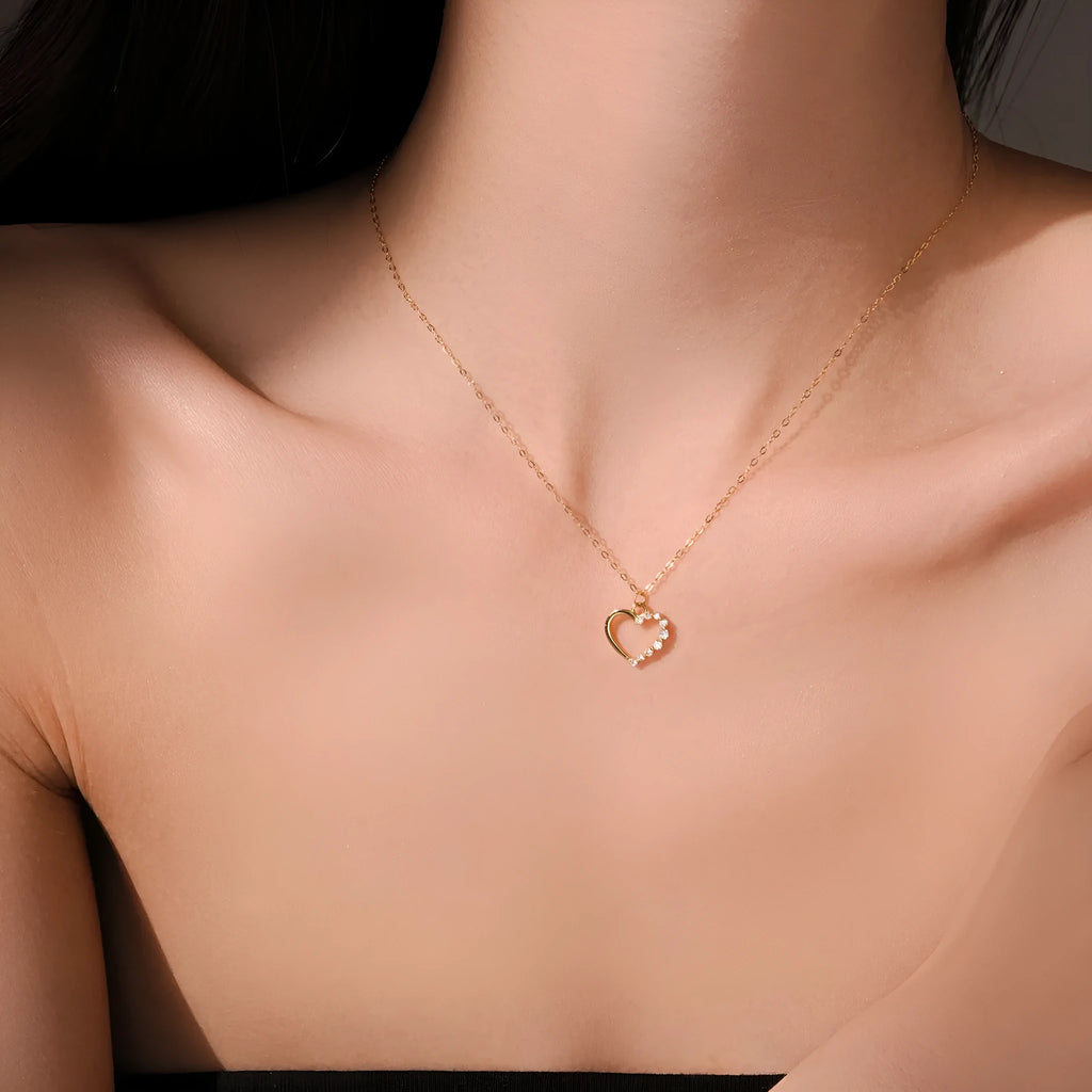 S925 sterling silver hollow heart pendant necklace on a chain with a gold plated finish.