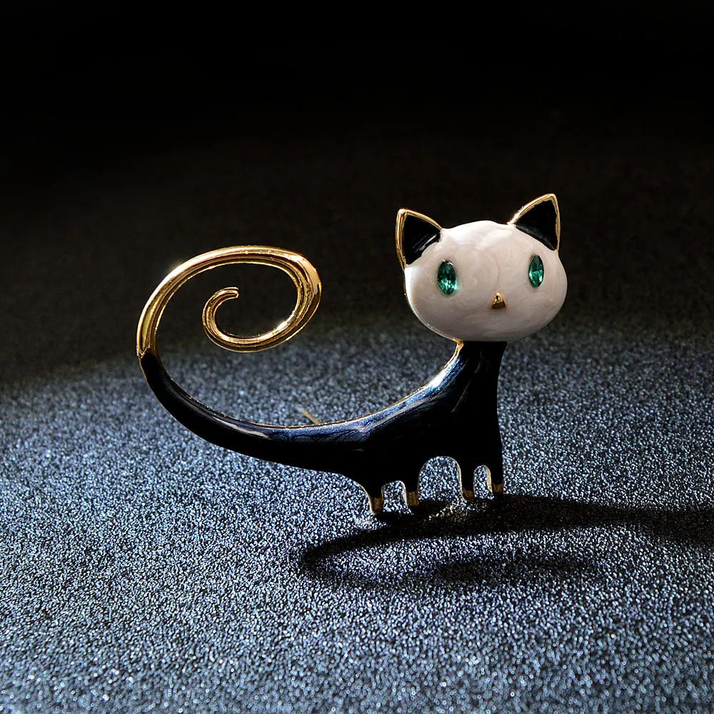 Alloy cat brooch with painted tail detail in white or orange colour for women's decorative fashion accessory