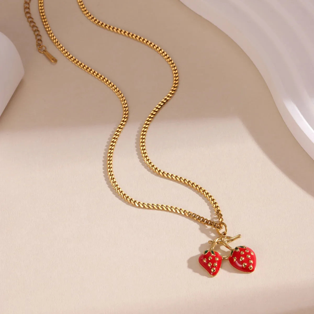 Women's stainless steel strawberry fruit pendant necklace in red and white gradient colours