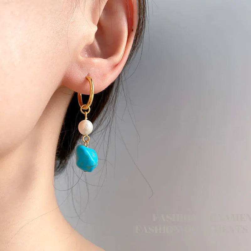 Turquoise and cultured pearl geometric ear clips with copper settings in short and dangle styles