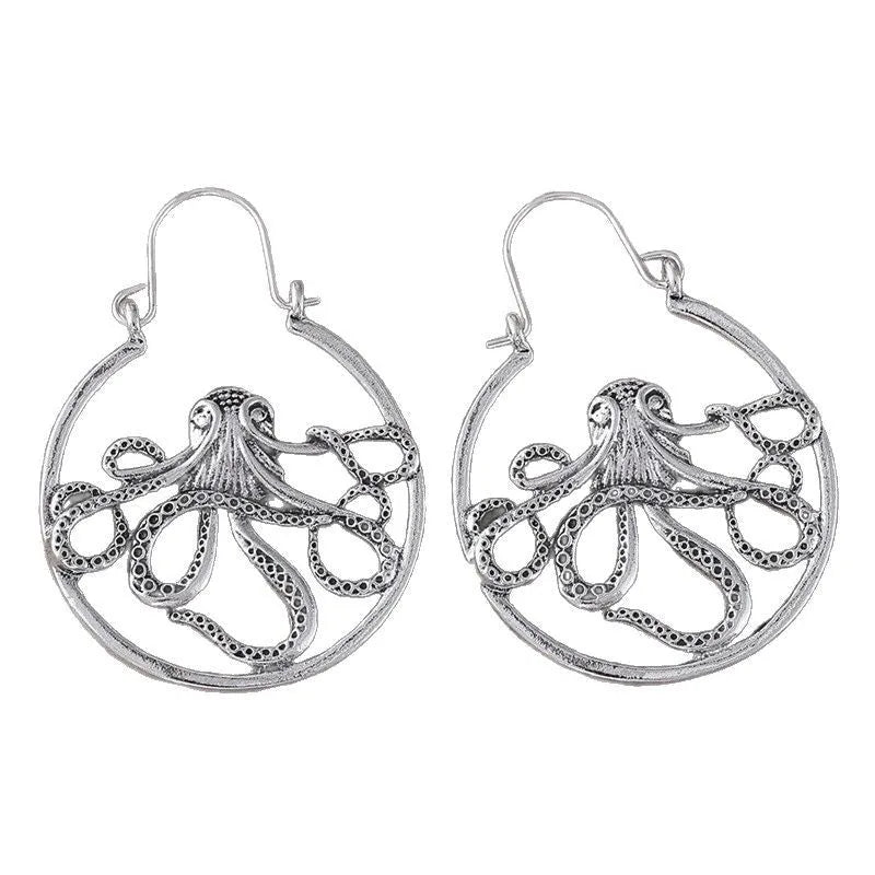 A pair of vintage antique silver octopus earrings with detailed animal modelling and a retro style.
