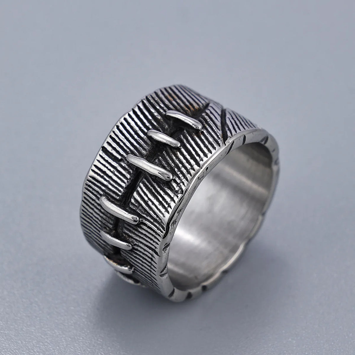 Titanium steel dark punk stitched ring with geometric U-shape design and double ring element in retro colour
