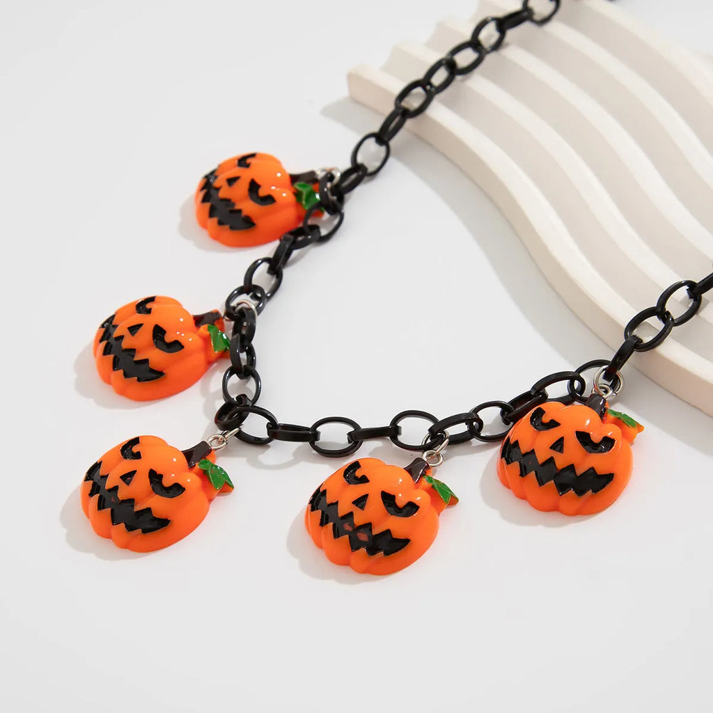 Cartoon pumpkin Halloween necklace with mixed colour acrylic pendant on a regular chain.