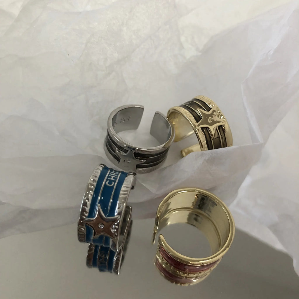 Adjustable geometric copper ring with distressed finish and XINGX drop oil design in selected colour.