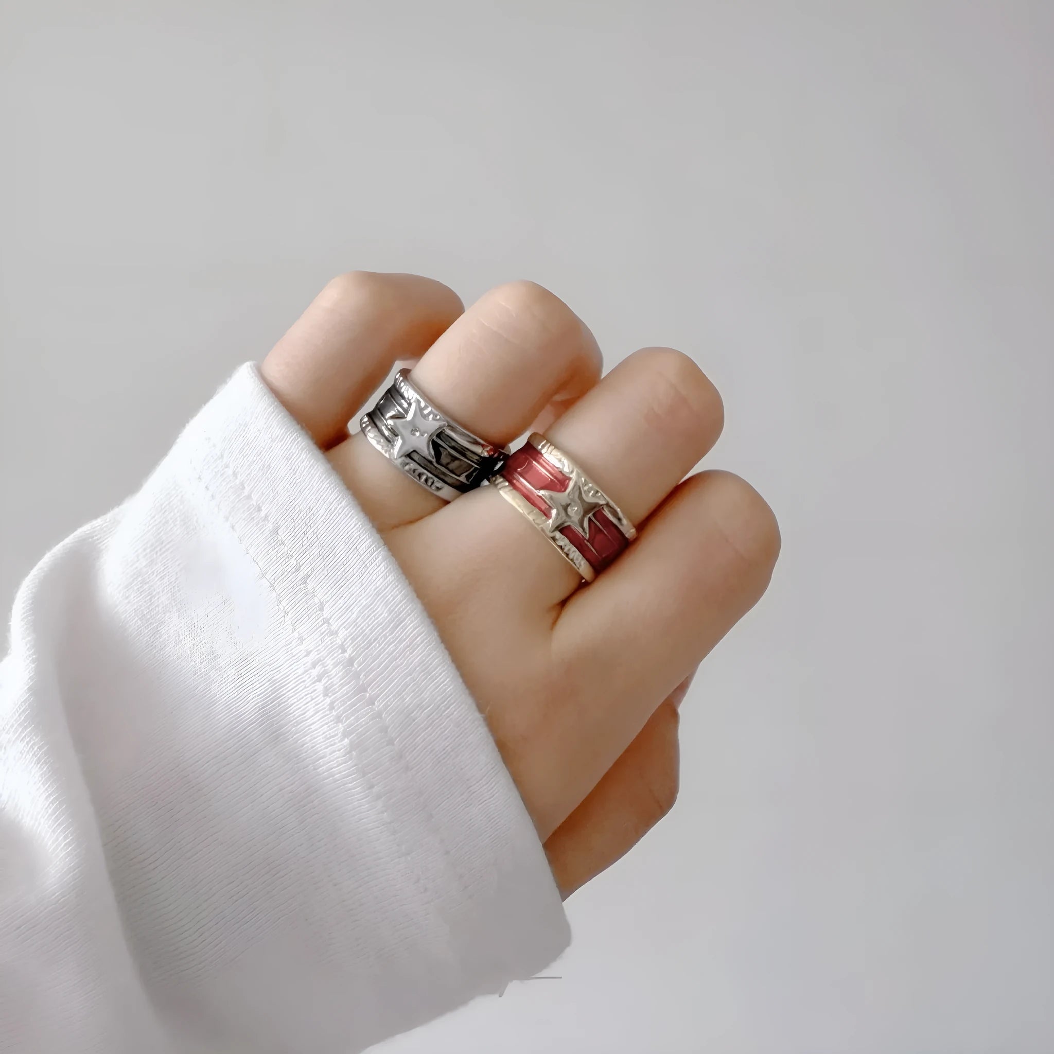 Adjustable geometric copper ring with distressed finish and XINGX drop oil design in selected colour.