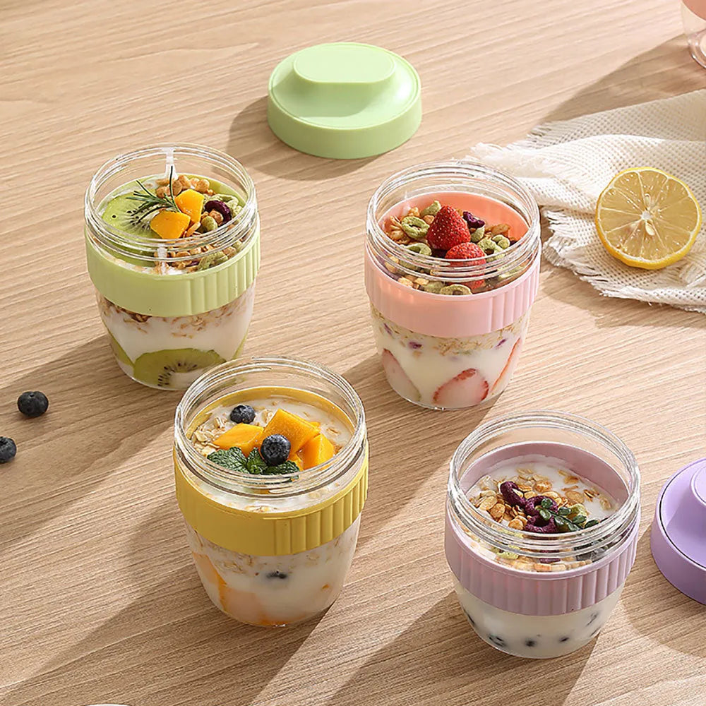 Green, purple, white, and pink plastic salad cups with lids and spoons in small and large sizes.