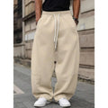 Men's straight high waist casual pants in bamboo fibre blend fabric showing elastic fit and cropped length