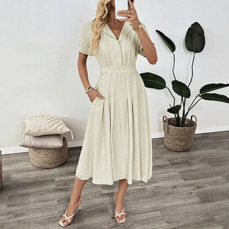 Light green women's shirt dress with lapel collar, waist tie, and side pockets
