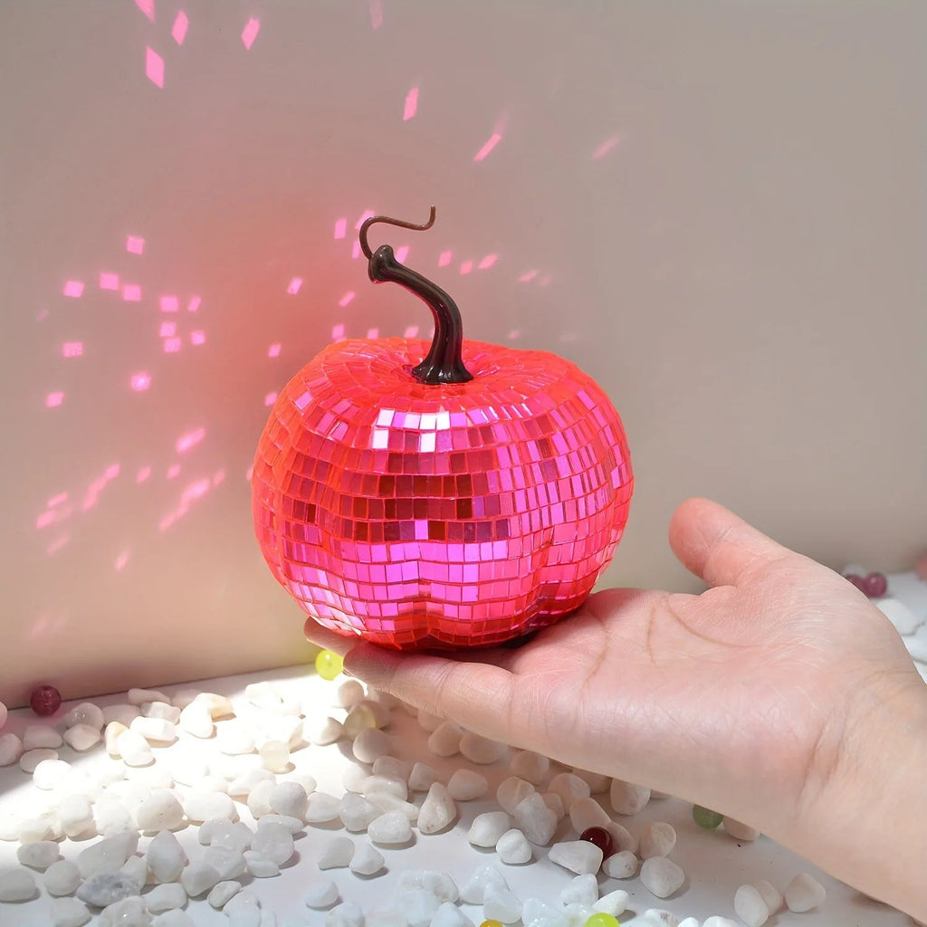 Handcrafted glass pumpkin ornament with embossed detail for Halloween and Christmas decoration.