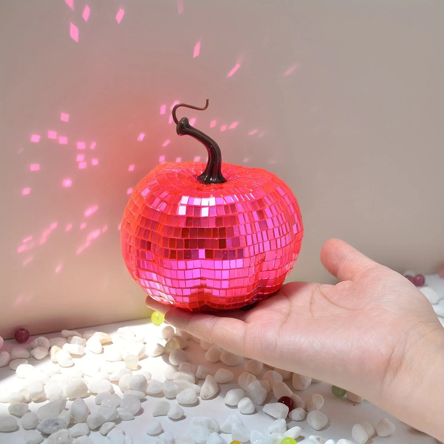 Handcrafted glass pumpkin ornament with embossed detail for Halloween and Christmas decoration.