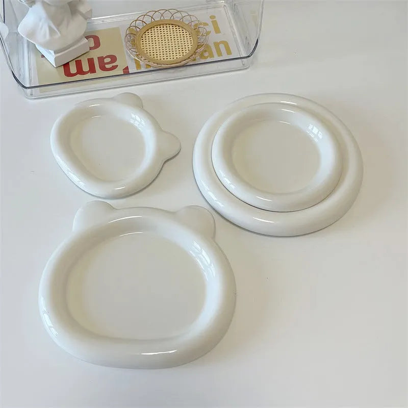 White ceramic plate with chubby toot bear illustration, porcelain potted tray.