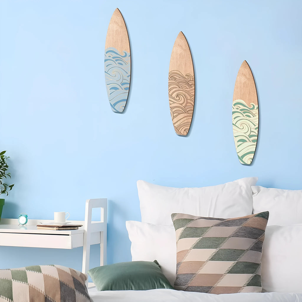 Three wooden surfboard wall decorations made from boxwood, shown together.